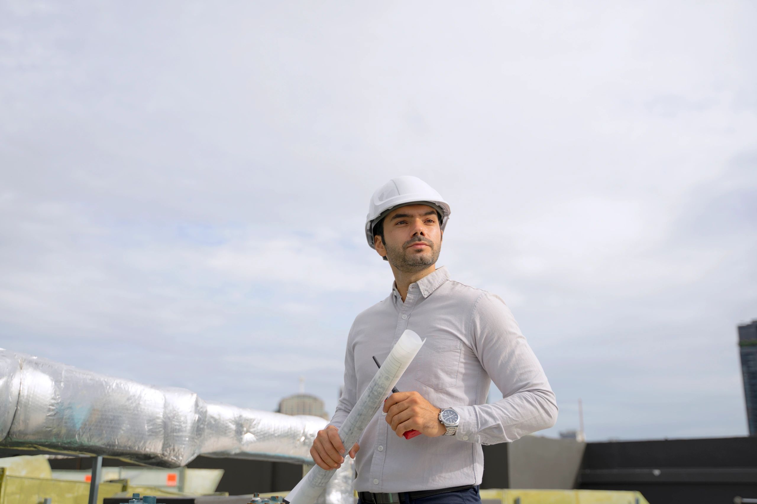 HVAC technician working on rooftop equipment